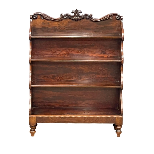 809 - An early William IV rosewood stepfront open bookcase with carved foliage gallery and cordoning mould... 