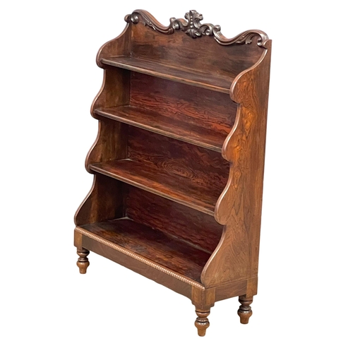 809 - An early William IV rosewood stepfront open bookcase with carved foliage gallery and cordoning mould... 