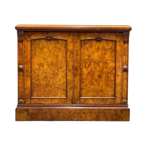 810 - A Victorian Burr Walnut double door side cabinet with Rosette mouldings and interior shelf. 91.5x55x... 