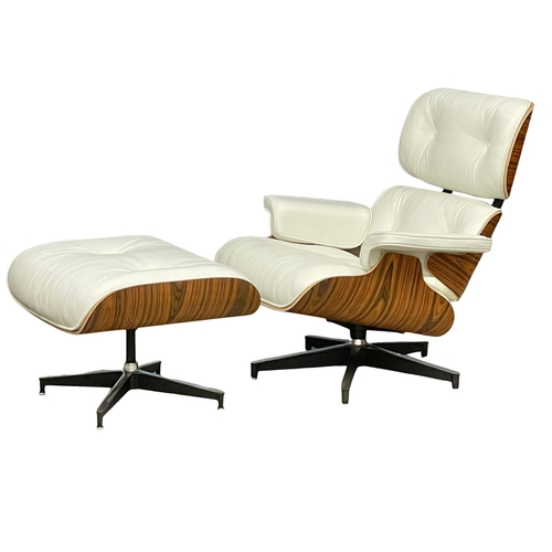 811 - A good quality Charles & Ray Eames style rosewood and leather swivel chair with ottoman. (13)