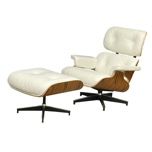 811 - A good quality Charles & Ray Eames style rosewood and leather swivel chair with ottoman. (13)