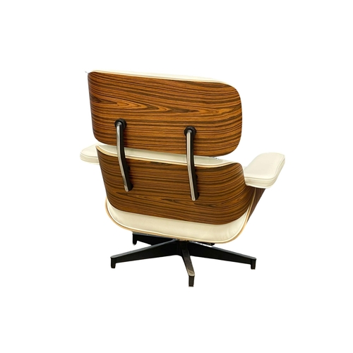 811 - A good quality Charles & Ray Eames style rosewood and leather swivel chair with ottoman. (13)