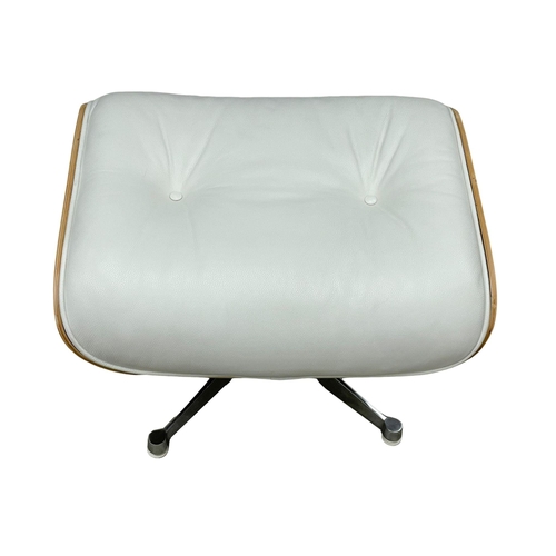 812 - A good quality Charles & Ray Eames style leather swivel chair with ottoman. (13)