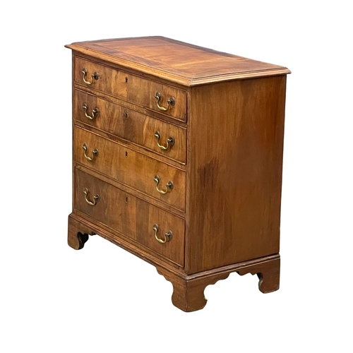 813 - A fine proportioned early George III mahogany oak lined chest of drawers with original brass drop ha... 