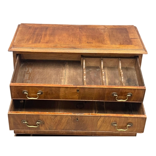 813 - A fine proportioned early George III mahogany oak lined chest of drawers with original brass drop ha... 