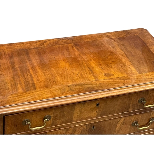 813 - A fine proportioned early George III mahogany oak lined chest of drawers with original brass drop ha... 