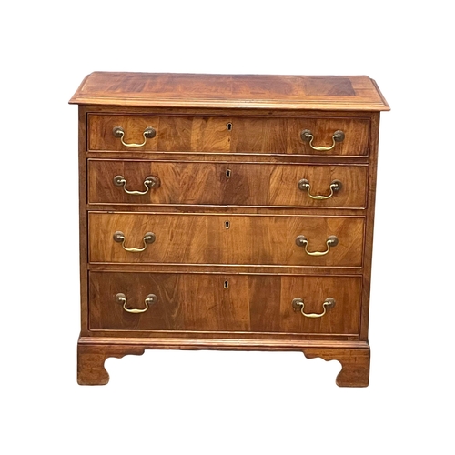 813 - A fine proportioned early George III mahogany oak lined chest of drawers with original brass drop ha... 