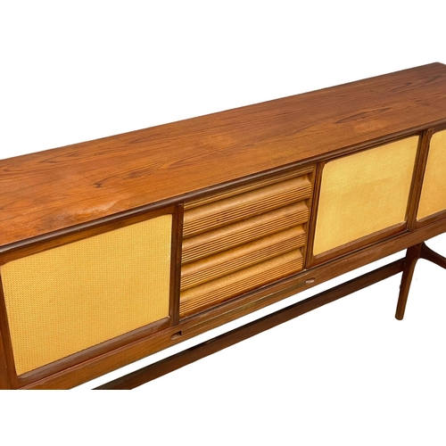 814 - An Elliots of Newbury Mid Century teak dining set. Highboard with retracting drop leaf dining table ... 