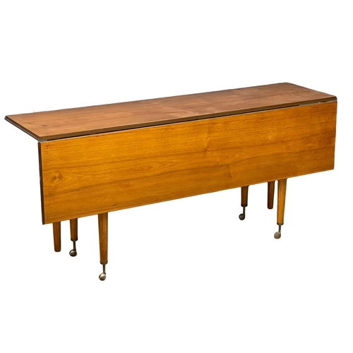 814 - An Elliots of Newbury Mid Century teak dining set. Highboard with retracting drop leaf dining table ... 