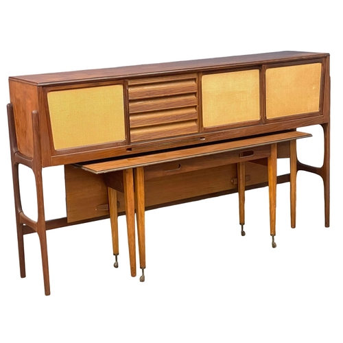 814 - An Elliots of Newbury Mid Century teak dining set. Highboard with retracting drop leaf dining table ... 