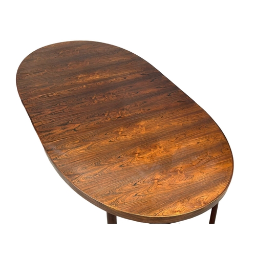 819 - An excellent quality Danish rosewood 2 leaf extending dining table. 1960’s. Closed 163x109x72.5cm. 2... 