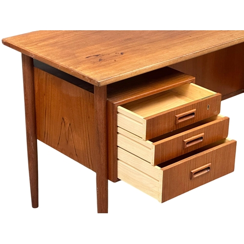 819A - A quality Danish Mid Century teak desk designed by Kai Kristiansen. 1960’s. 121.5x59.5x74cm (4)