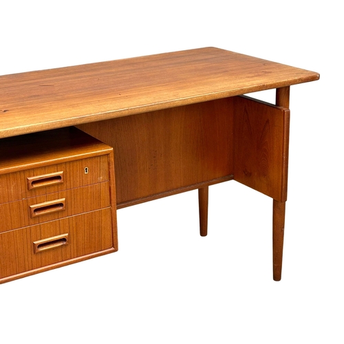 819A - A quality Danish Mid Century teak desk designed by Kai Kristiansen. 1960’s. 121.5x59.5x74cm (4)