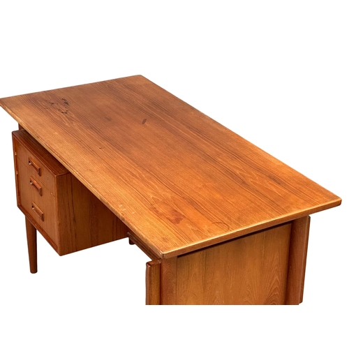 819A - A quality Danish Mid Century teak desk designed by Kai Kristiansen. 1960’s. 121.5x59.5x74cm (4)