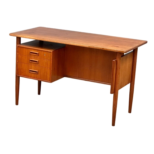 819A - A quality Danish Mid Century teak desk designed by Kai Kristiansen. 1960’s. 121.5x59.5x74cm (4)