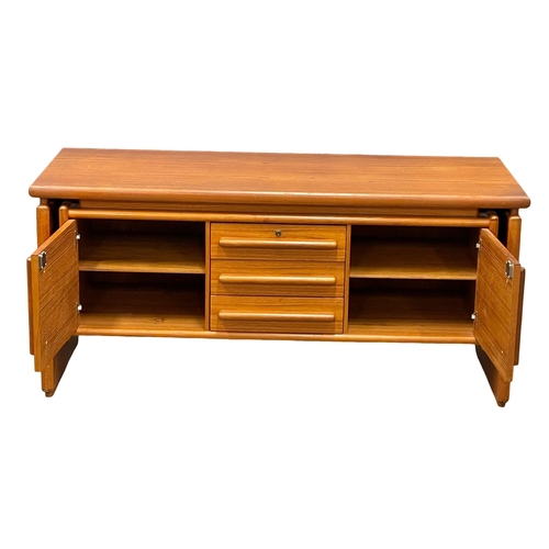 827 - A Danish Mid Century teak sideboard. 145x58x66cm (2)