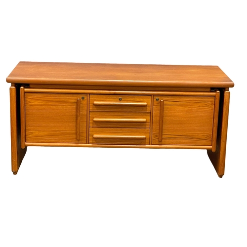 827 - A Danish Mid Century teak sideboard. 145x58x66cm (2)