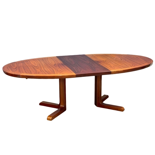 832 - A Danish Mid Century rosewood extending dining table. Open 230x120x73cm. Closed 180x120x73cm (3)