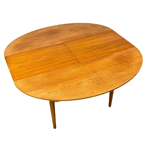 845 - A Greaves & Thomas 1960’s Mid Century teak extending dining table. Open 142.5x137x74cm. Closed 142.5... 