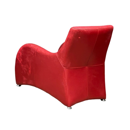 849 - A leather ‘Loge’ lounge chair and stool designed by Gerard van den Berg for Montis. (5)