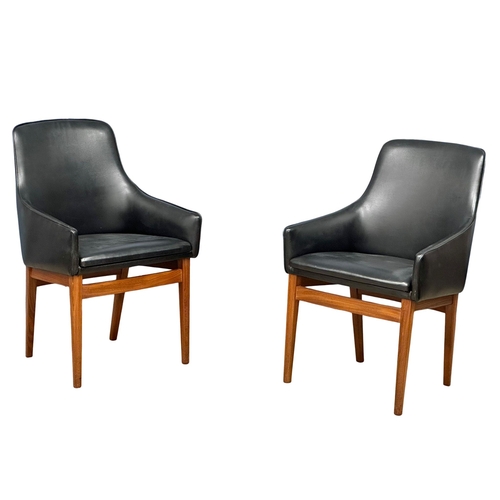 852 - A pair of good quality Mid Century teak and black vinyl armchairs. 1960’s. (8)