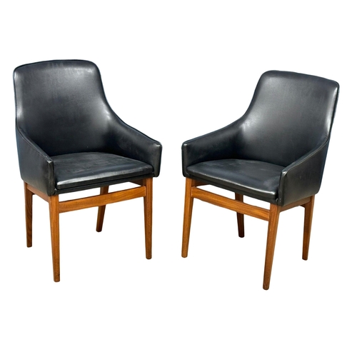 852 - A pair of good quality Mid Century teak and black vinyl armchairs. 1960’s. (8)