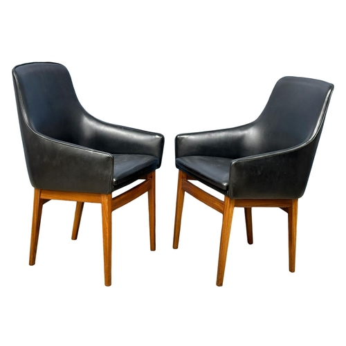 852 - A pair of good quality Mid Century teak and black vinyl armchairs. 1960’s. (8)