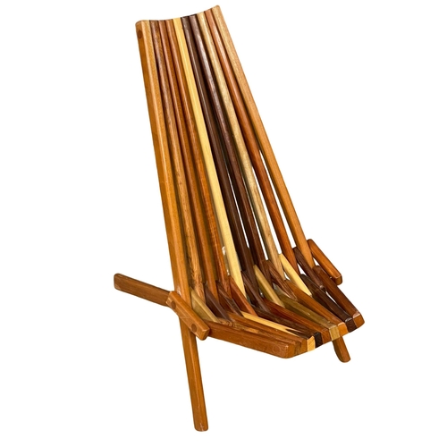 855 - A pair of Mid Century Modern teak and rosewood folding deck chairs with matching side table. (11)