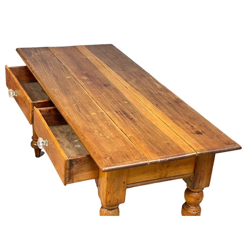 869 - A Victorian pine farmhouse kitchen table with 2 drawers and glass handles. 153x67x76cm (2)