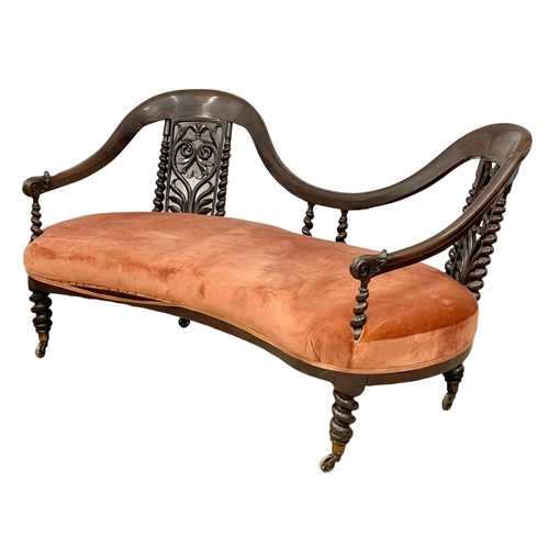 871 - A Victorian carved mahogany double end chaise lounge with Barley Twist supports and legs, on brass c... 