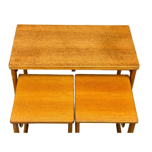 875 - A McIntosh ‘Triform’ Mid Century teak  turnover coffee table with 2 nesting tables. (1)