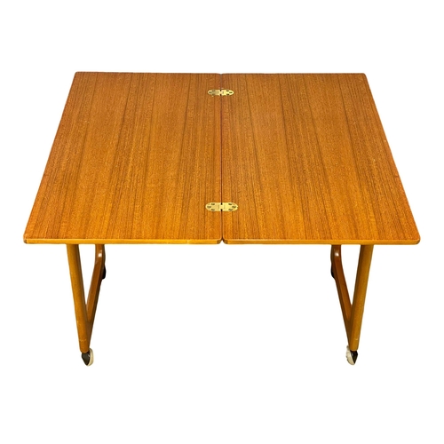 875 - A McIntosh ‘Triform’ Mid Century teak  turnover coffee table with 2 nesting tables. (1)