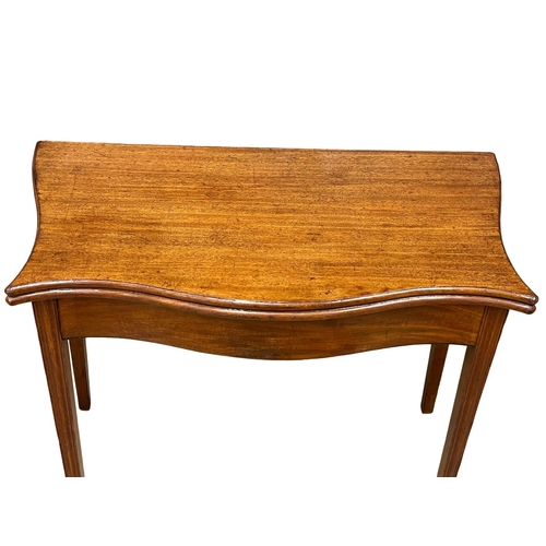 881 - A George III mahogany Serpentine front turnover tea table, circa 1790-1800. 87x46x75.5cm (1)