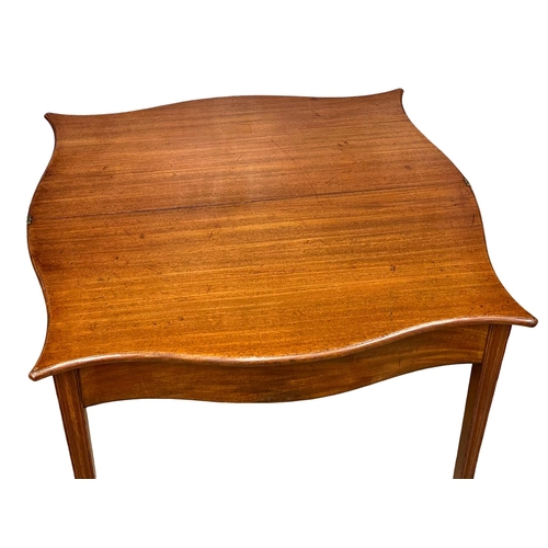 881 - A George III mahogany Serpentine front turnover tea table, circa 1790-1800. 87x46x75.5cm (1)