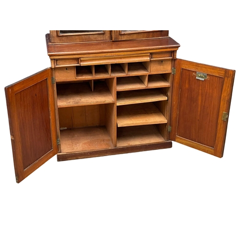 882 - A Victorian mahogany secretaire  bookcase, with double glazed door and adjustable shelves. 85x52x210... 