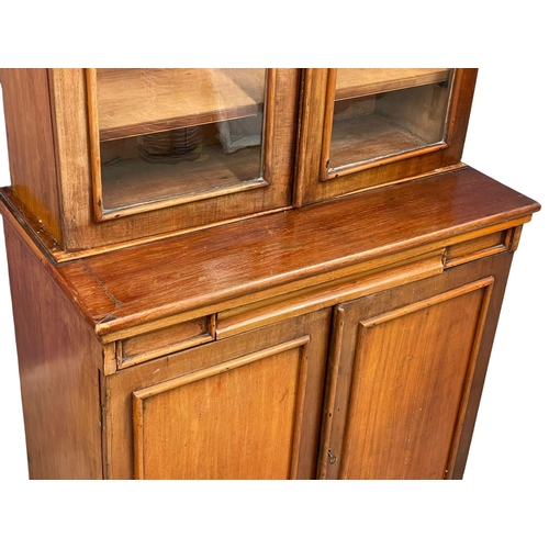 882 - A Victorian mahogany secretaire  bookcase, with double glazed door and adjustable shelves. 85x52x210... 