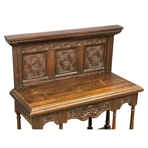 883 - A good quality 19th century Jacobean Revival oak buffet console table with carved Man of the Forest ... 