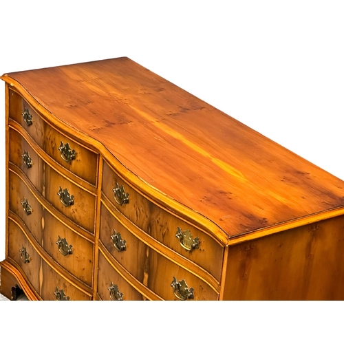 892 - A Georgian style Yew Wood serpentine front chest of drawers on bracket feet. 119x48x82cm (4)