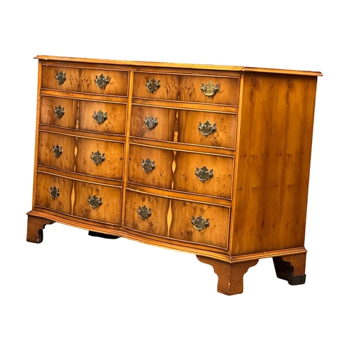 892 - A Georgian style Yew Wood serpentine front chest of drawers on bracket feet. 119x48x82cm (4)