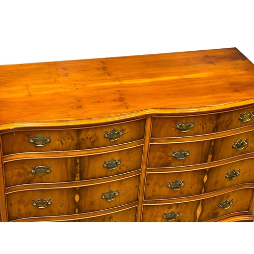 892 - A Georgian style Yew Wood serpentine front chest of drawers on bracket feet. 119x48x82cm (4)