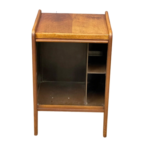 898 - A Mid Century walnut record cabinet with sliding tambour door. 1950-1960. 45x38x67cm (2)