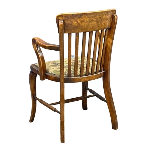 901 - An Edwardian desk chair. (10)