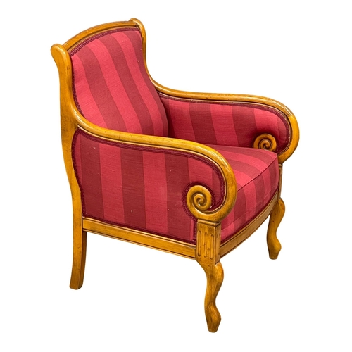 903 - A Regency style armchair. (2)