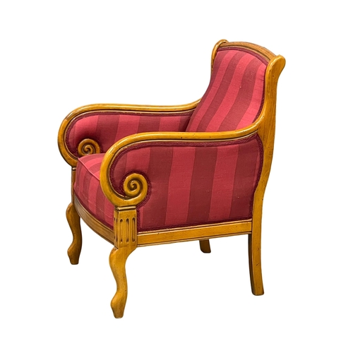 903 - A Regency style armchair. (2)