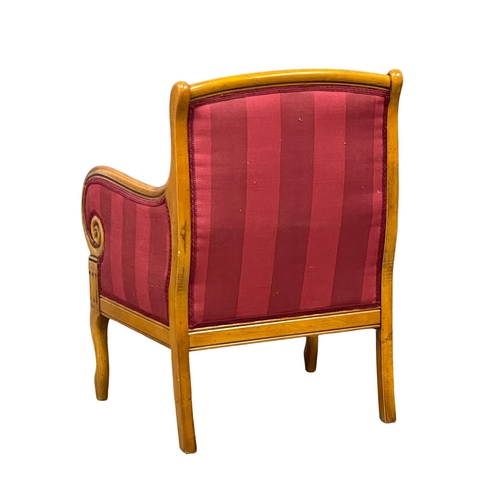 903 - A Regency style armchair. (2)