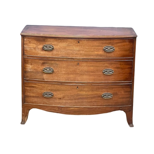 905 - A George III mahogany bow front chest of drawers on splayed feet, in the Sheraton style. Circa 1790-... 