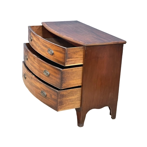 905 - A George III mahogany bow front chest of drawers on splayed feet, in the Sheraton style. Circa 1790-... 