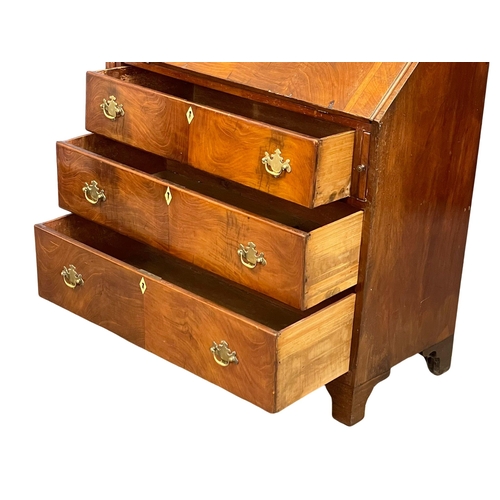 910 - A late George III mahogany writing bureau with 3 drawers and brass drop handles on bracket feet. Cir... 