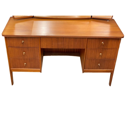 913 - A Mid Century teak dressing table designed by Peter hayward for Vanson. 1960. 133x49x133cm
(3)