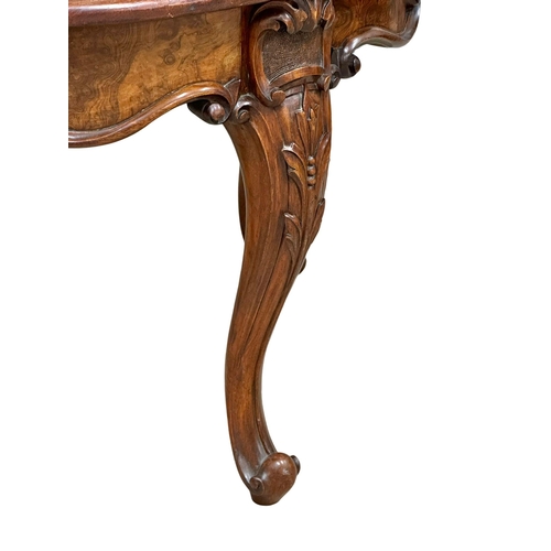 920 - A Victorian Burr Walnut and mahogany Demi Lune hall table on cabriole legs. Circa 1860. 78x50.5x68cm... 